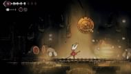 Strike the circular bell to initiate a fight (Image via Team Cherry || YouTube@100% Guides)
